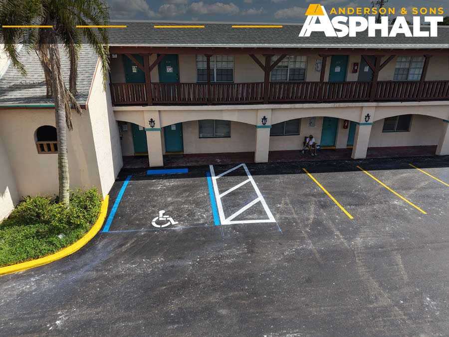 Newly resurfaced parking lot with freshly painted accessible parking spaces