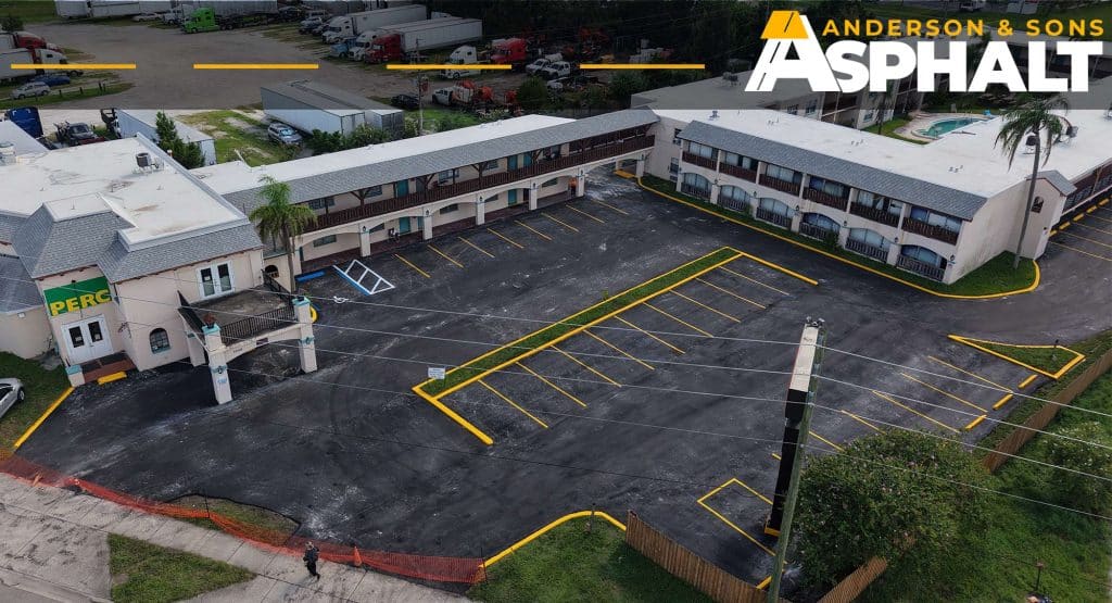 Drone view of completed commercial asphalt resurfacing and parking lot striping